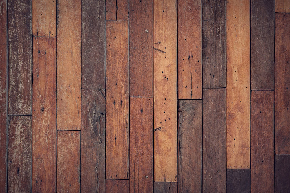 What causes a hardwood floor to bow, and how do you fix it?